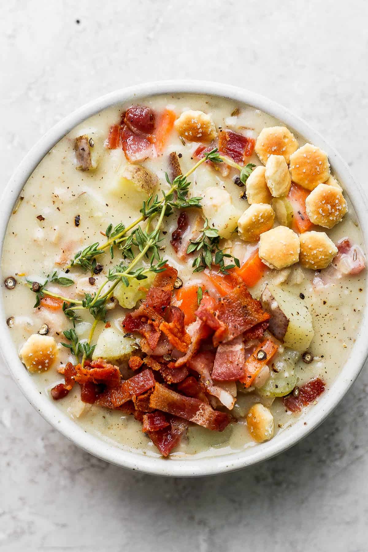 Dairy free clam chowder in a white bowl.