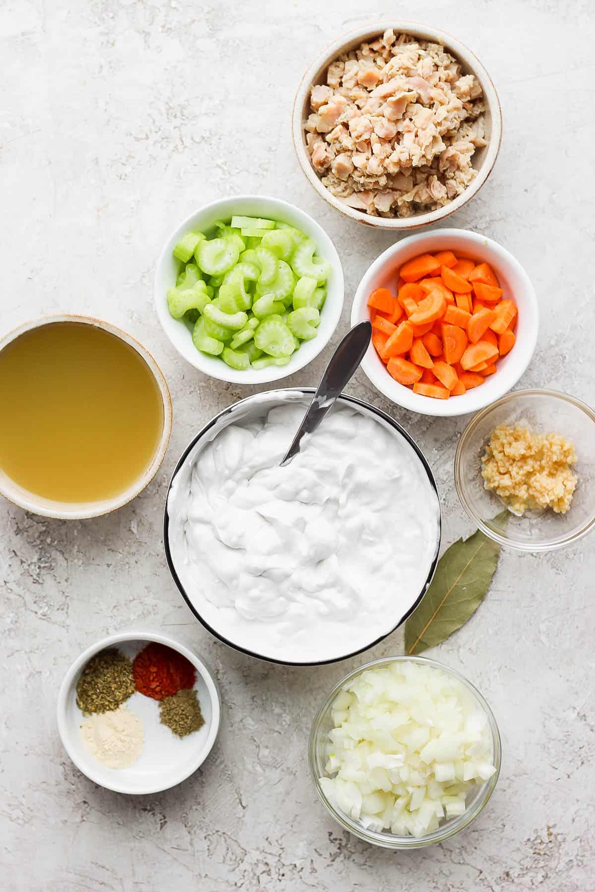 Soup ingredients in separate bowls.