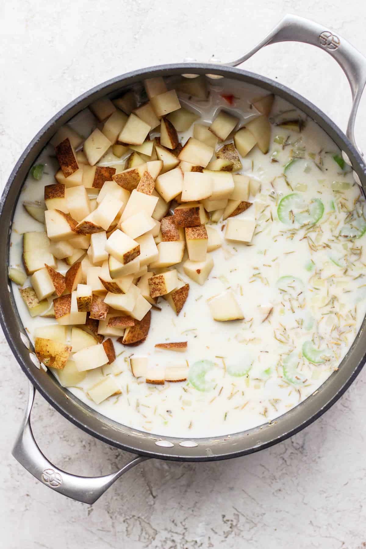 Chunks of potatoes added to the pot.
