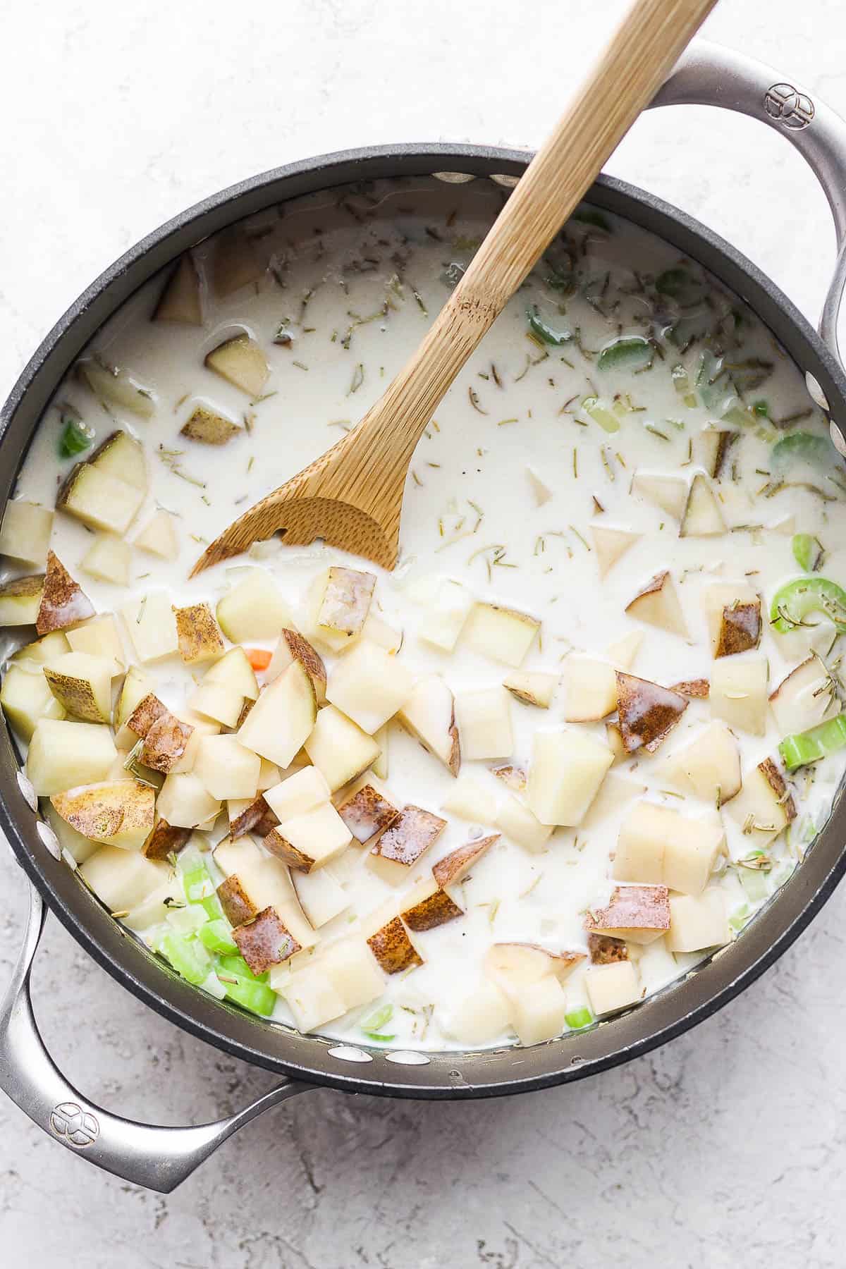 Potatoes mixed in and cooked until tender and soft.