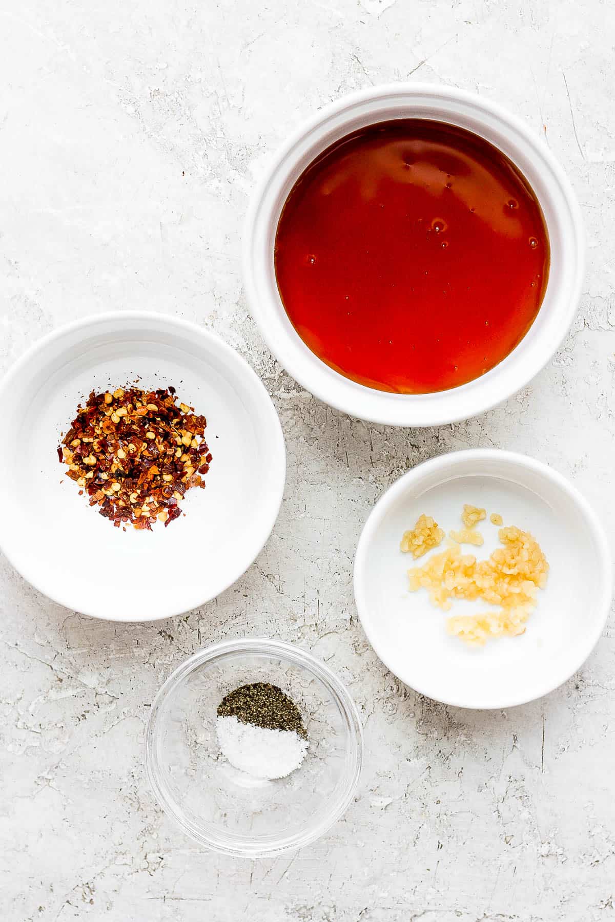 Hot honey sauce ingredients in separate bowls.