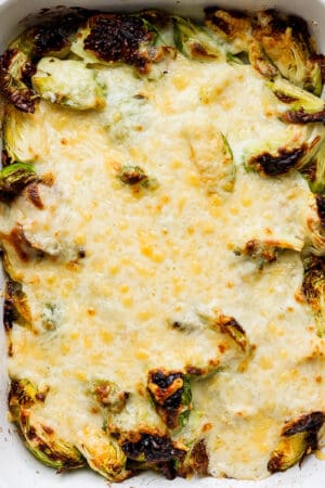 A casserole dish filled with brussel sprouts au gratin.