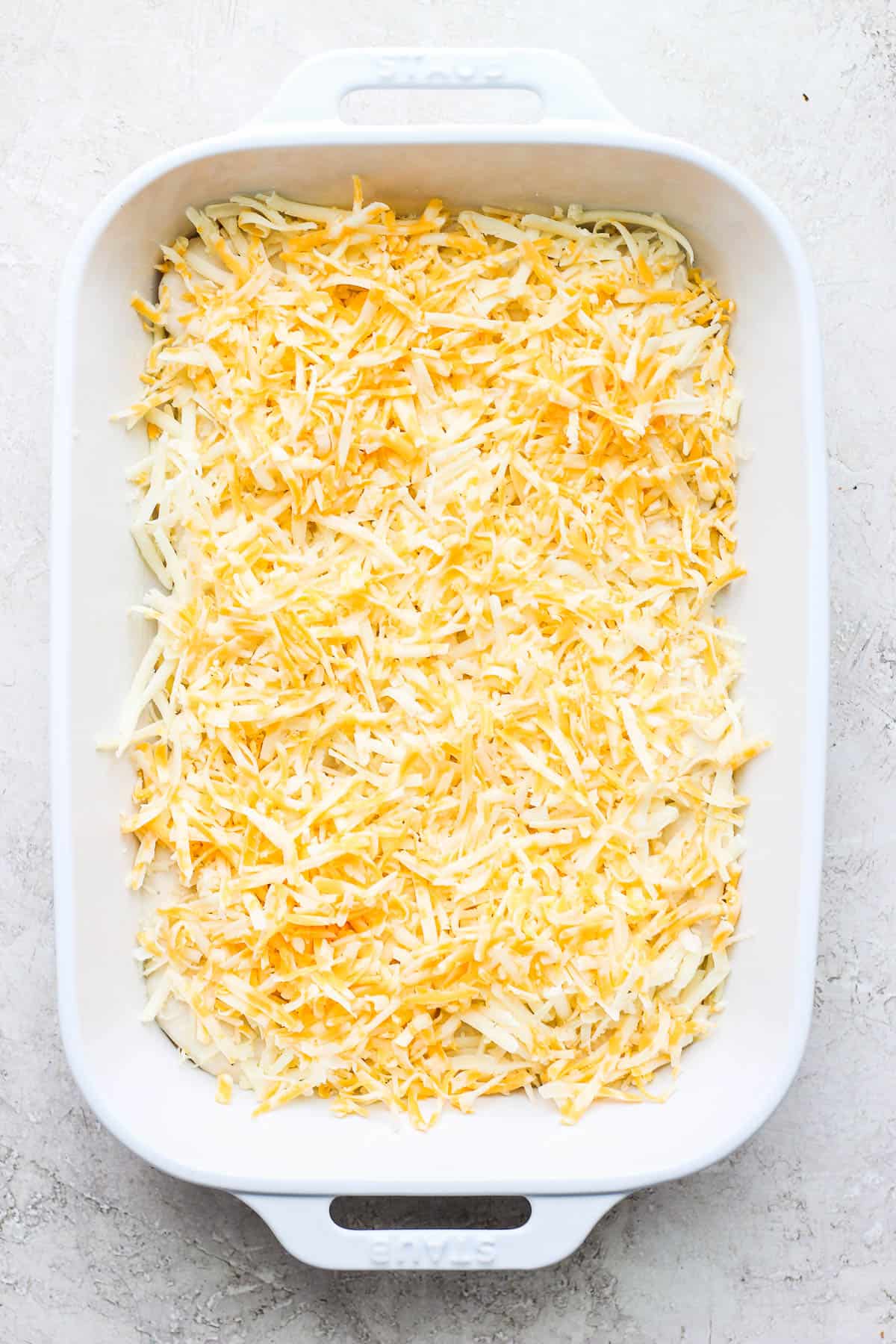 Half of the shredded cheese added on top.
