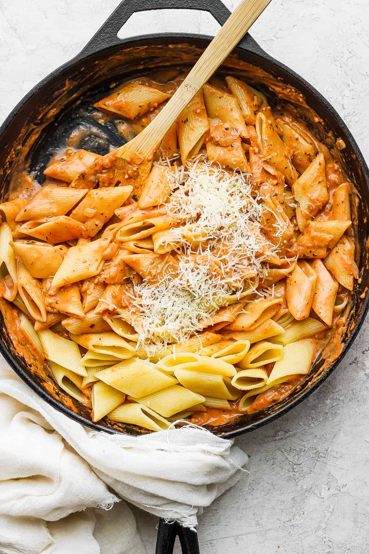 Noodles added to the skillet with a little parmesan cheese on top.