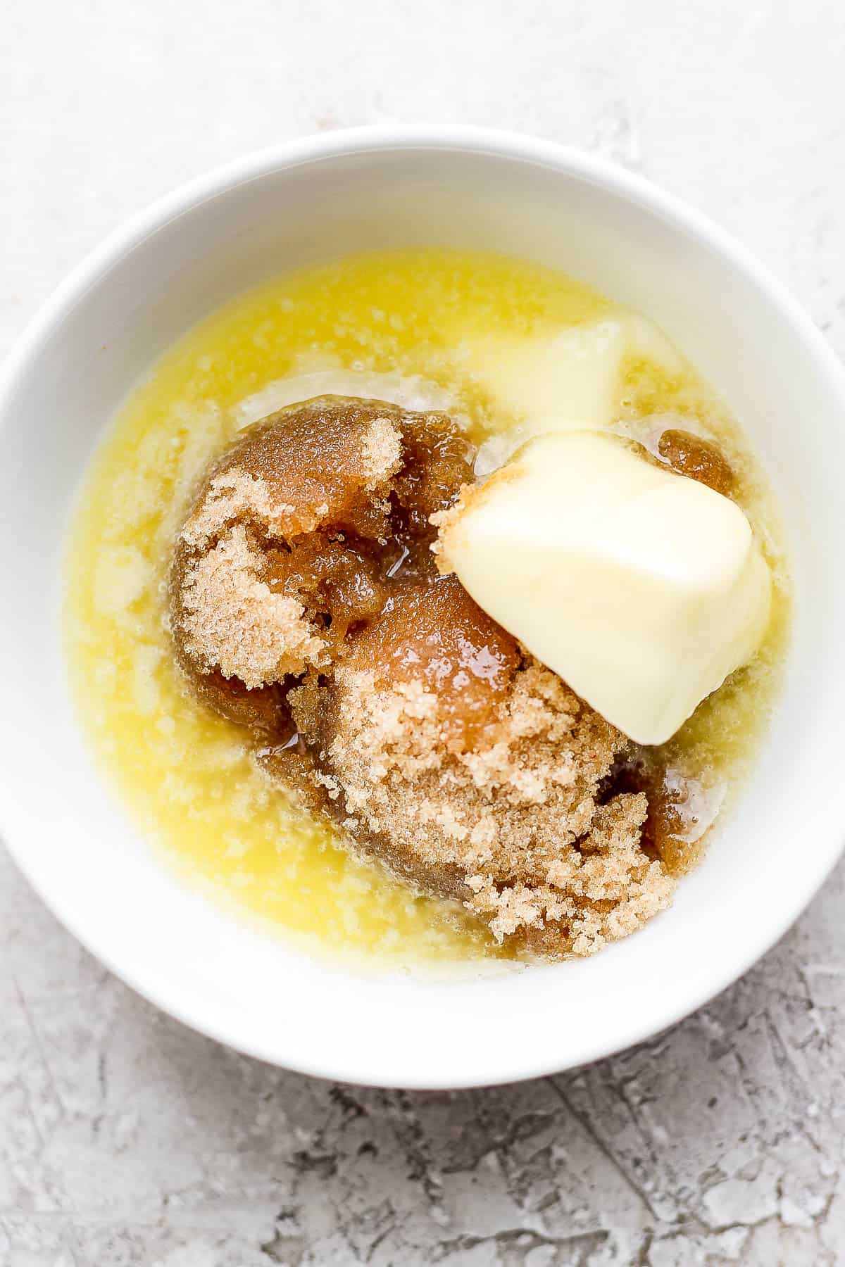 Brown sugar glaze ingredients in a small white bowl.