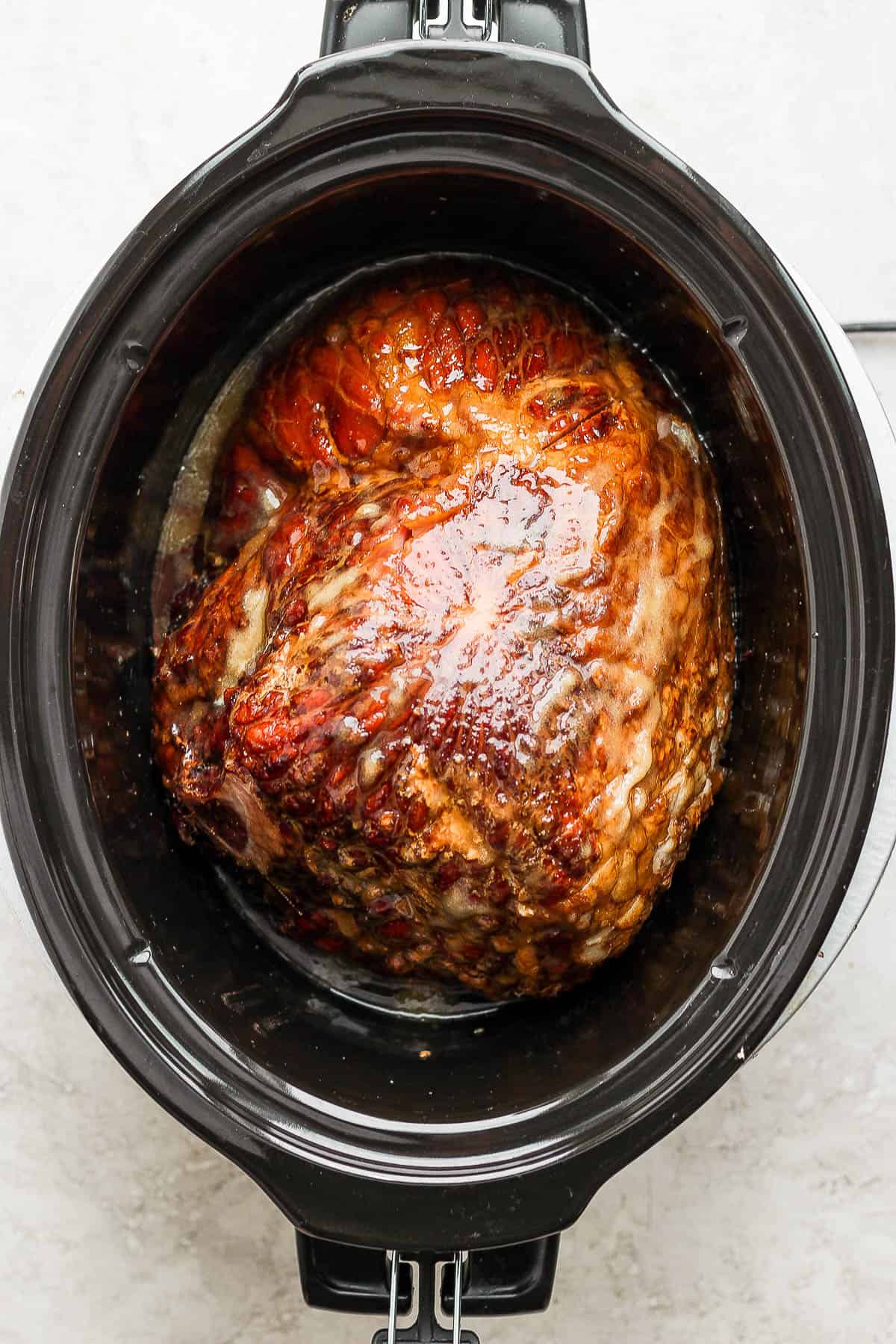 Fully cooked ham in a slow cooker.