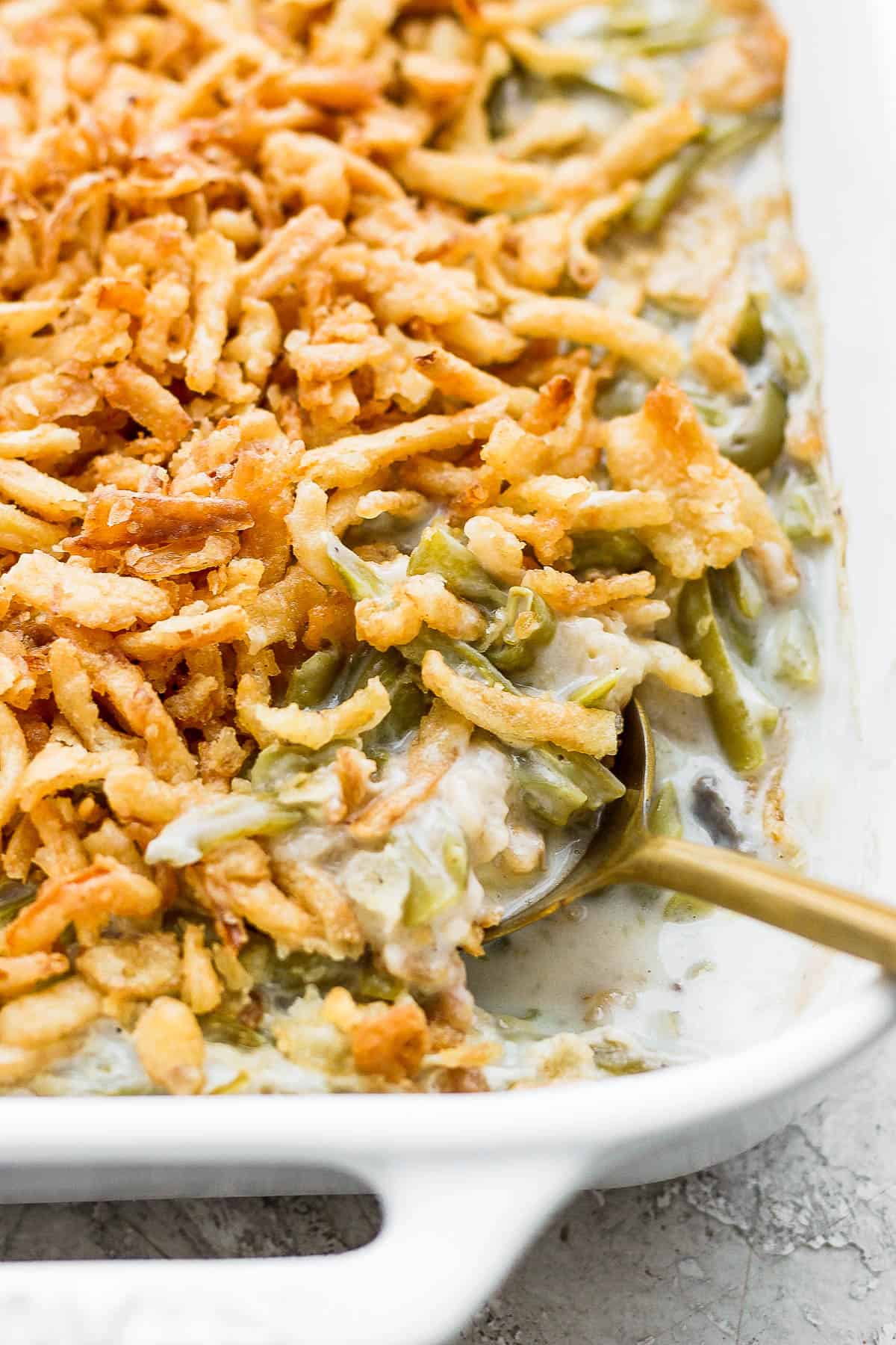Easy green bean casserole with a spoon in it.