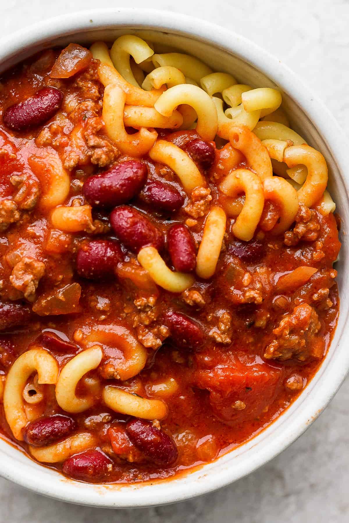 Goulash in a serving bowl with macaroni noodles.