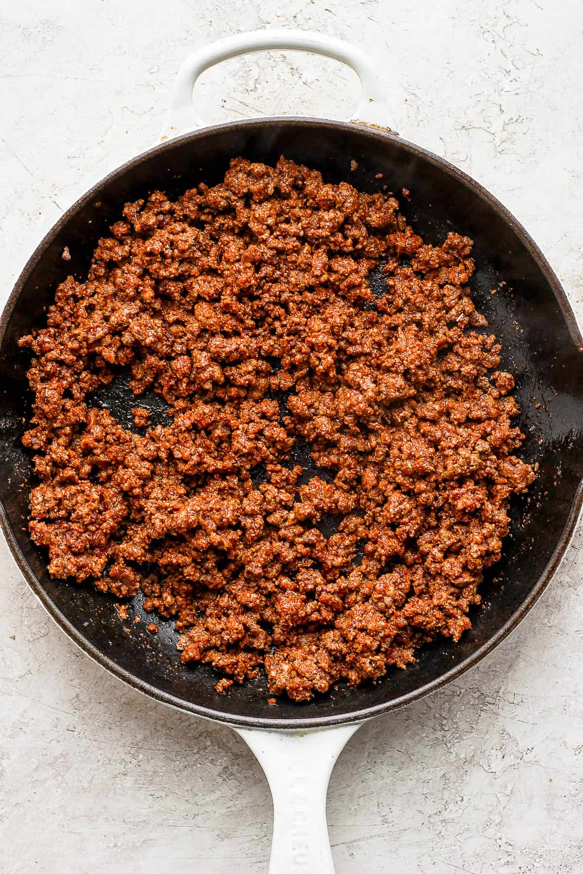 Seasonings mixed throughout the ground beef.