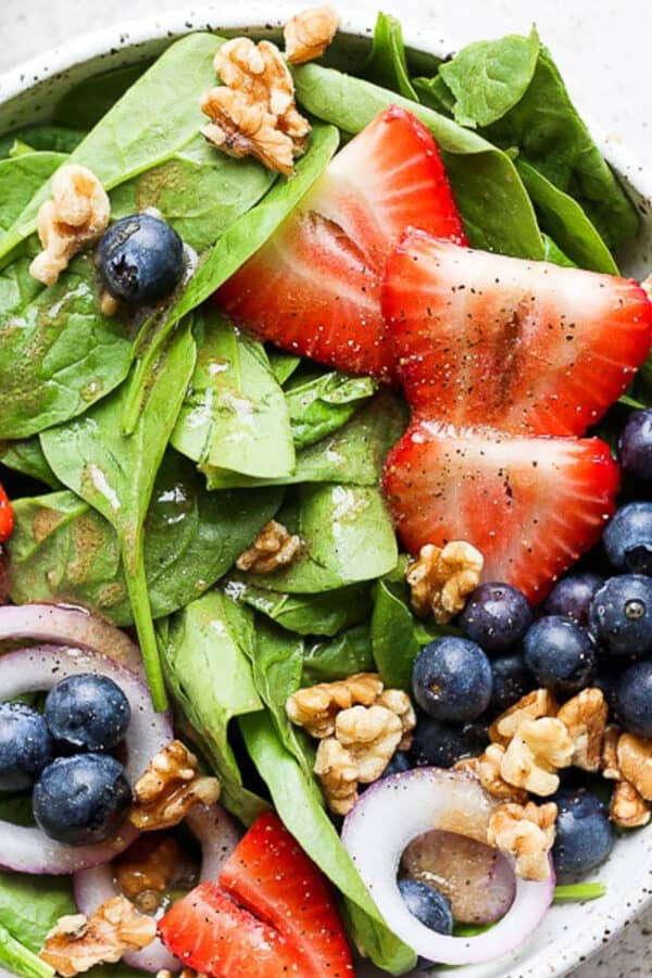 A classic strawberry blueberry spinach salad.