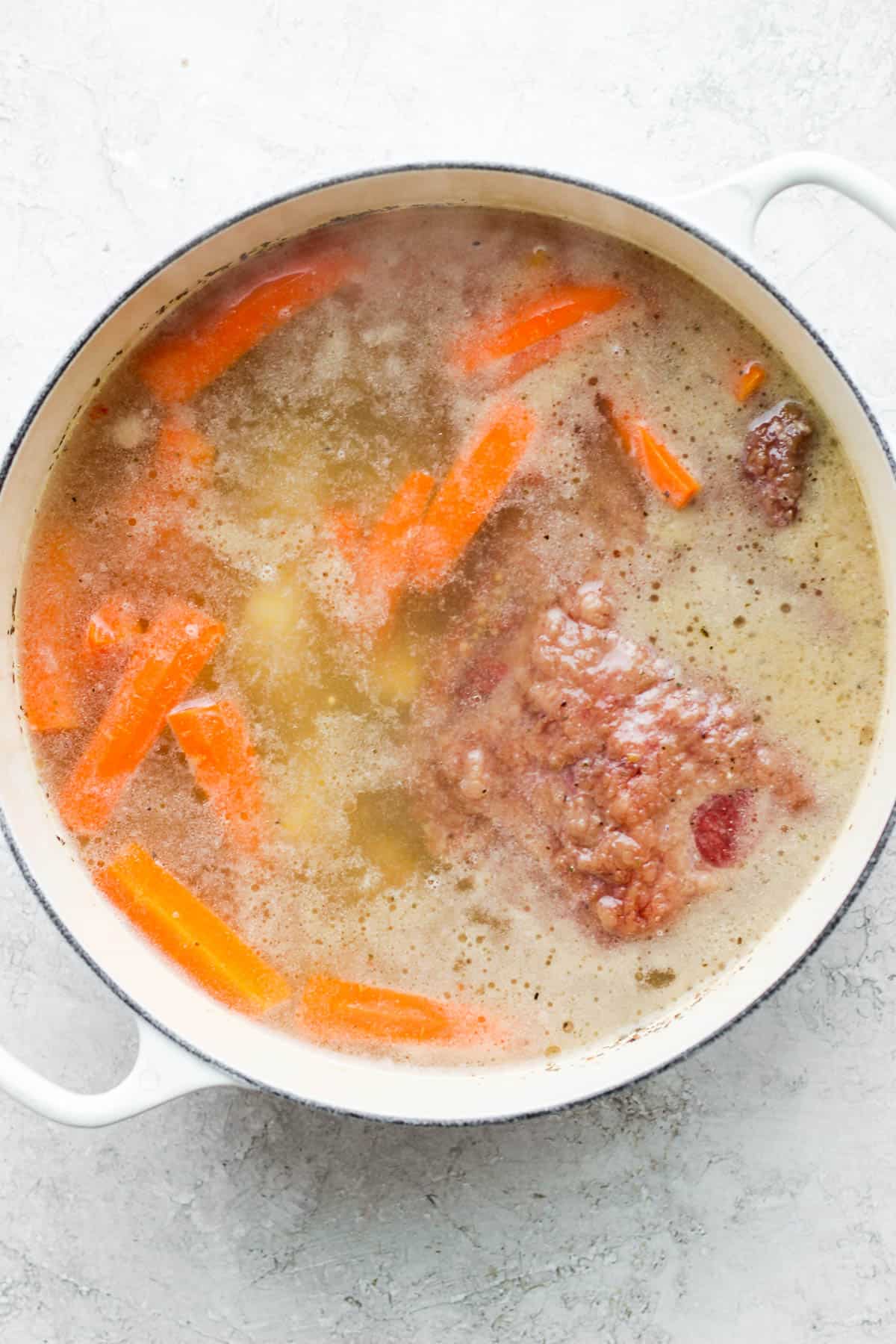 Carrots, potatoes, and onions added to the dutch oven.