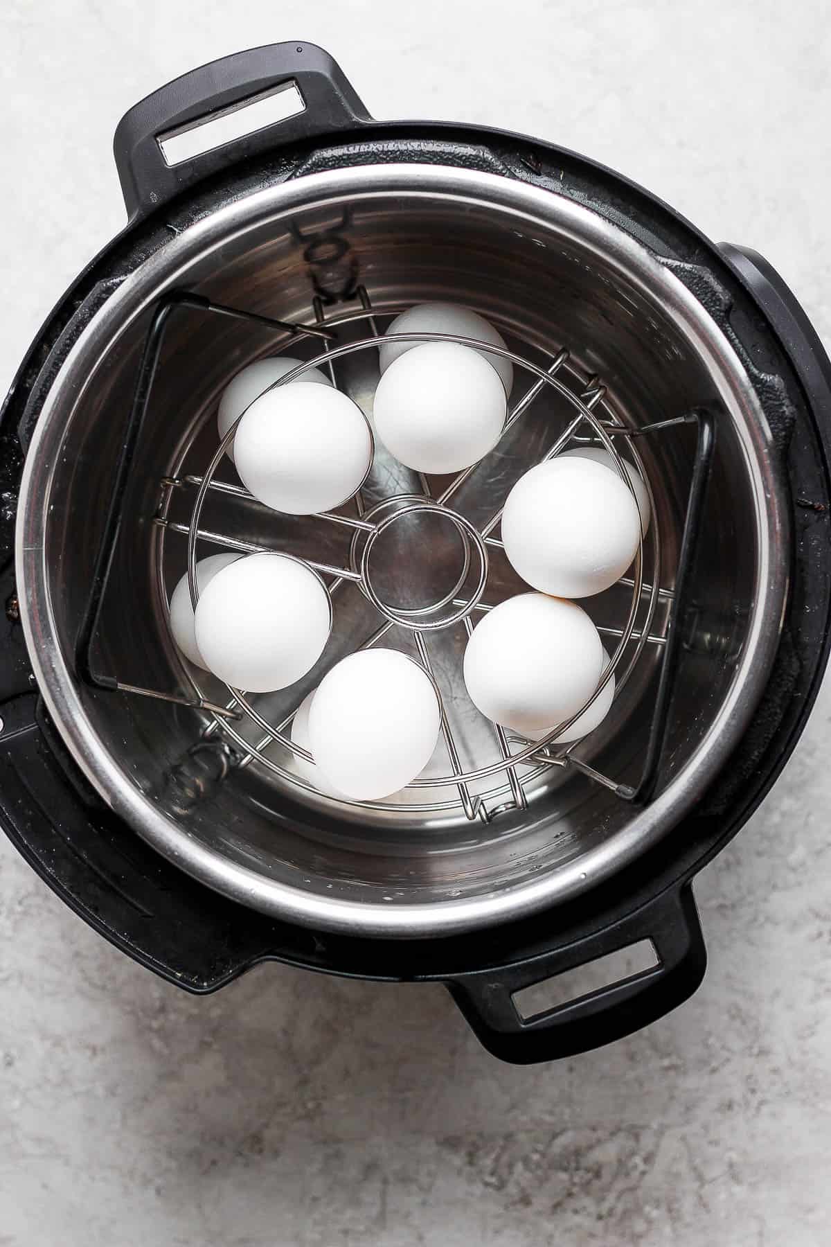 A top down shot of the egg insert with the eggs in the instant pot. 