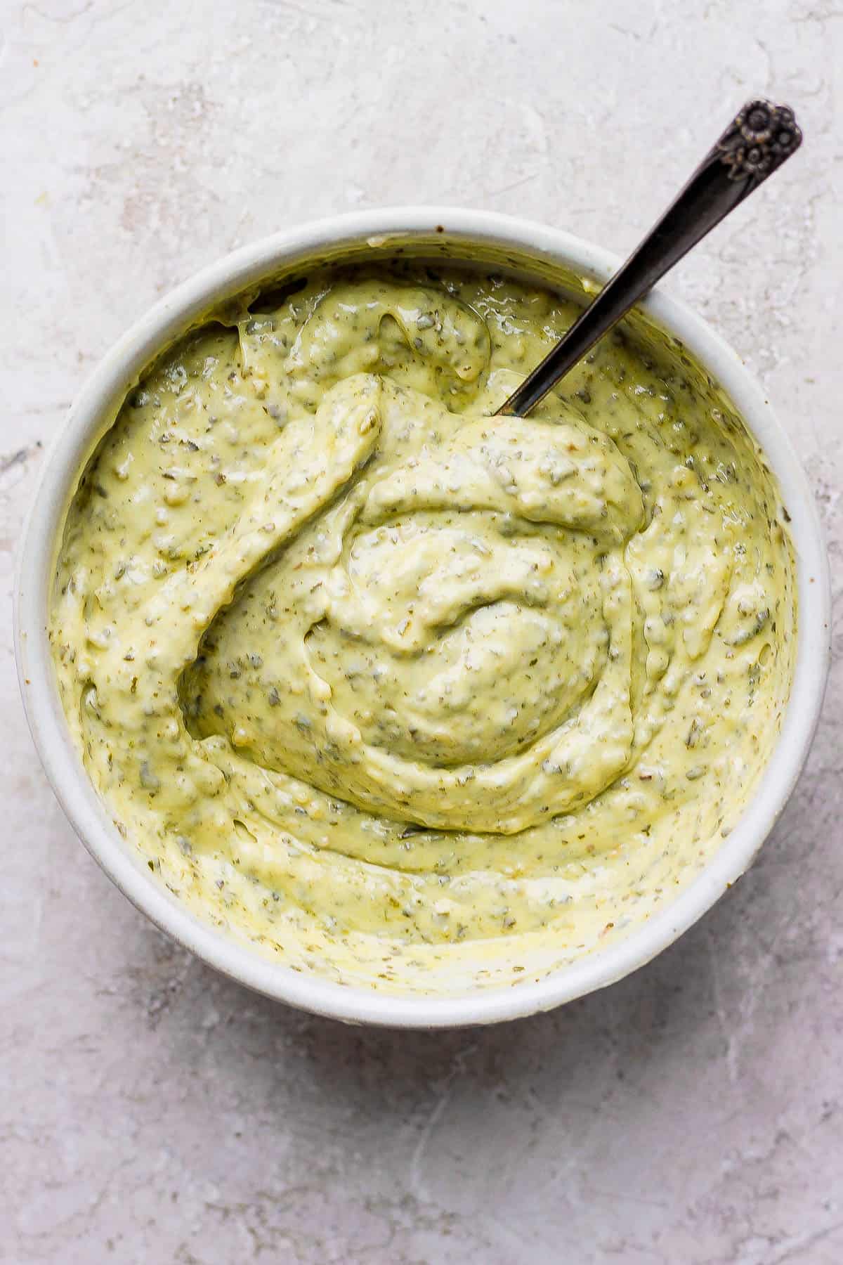 Pesto aioli in a small bowl.