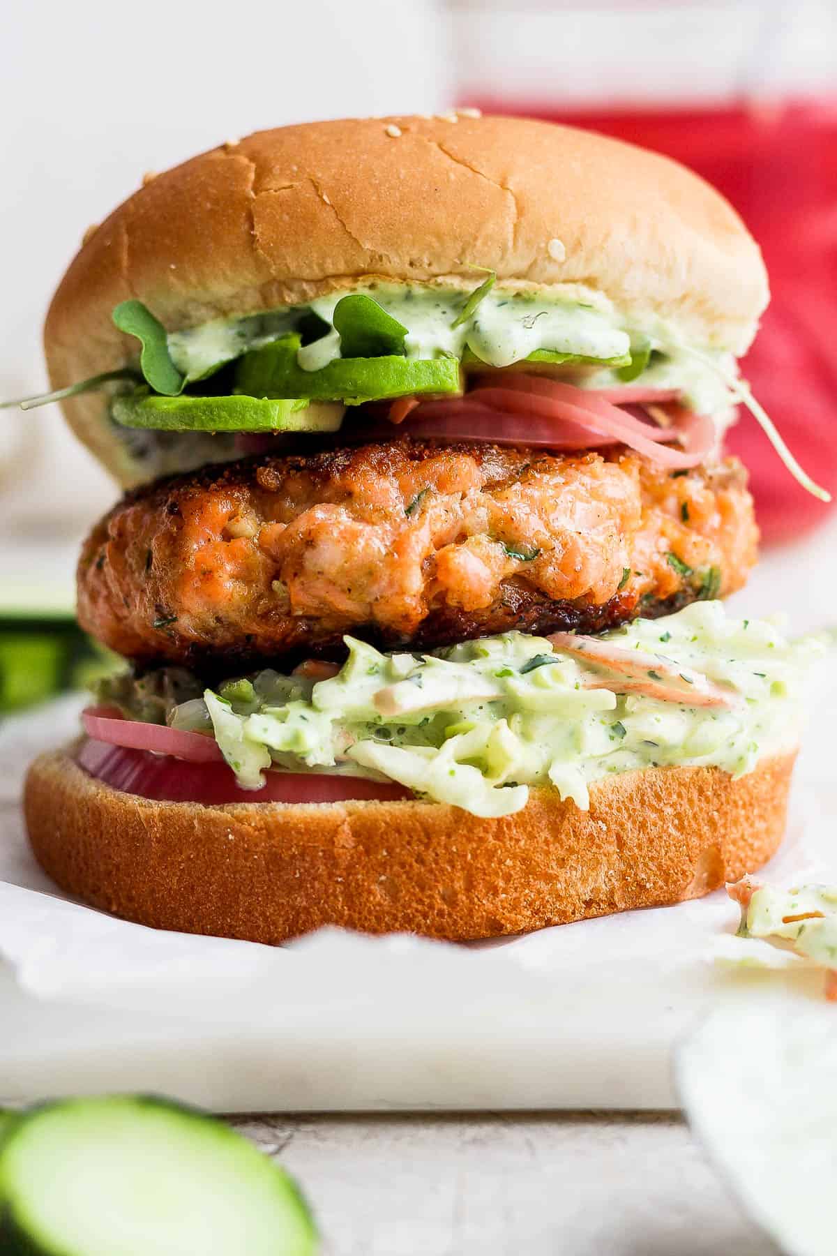 A fully topped salmon burger.