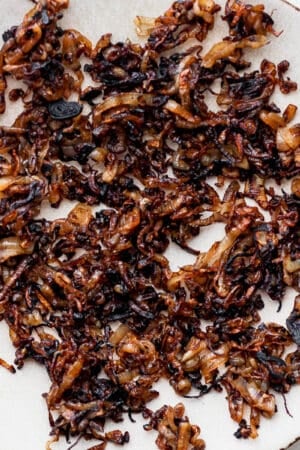 A plate filled with crispy shallots.