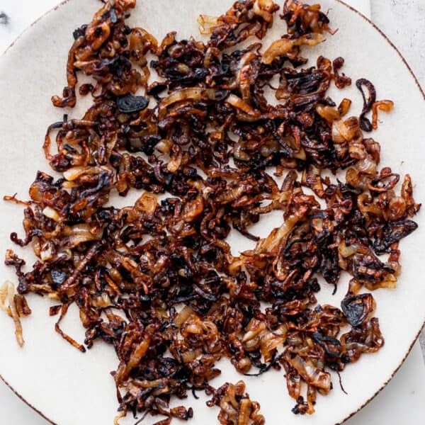 A plate filled with crispy shallots.