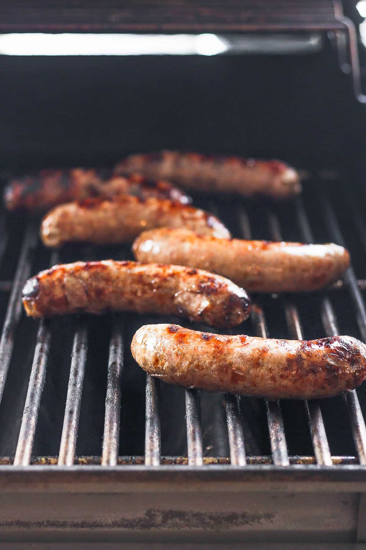 Grilled brats on the grill.