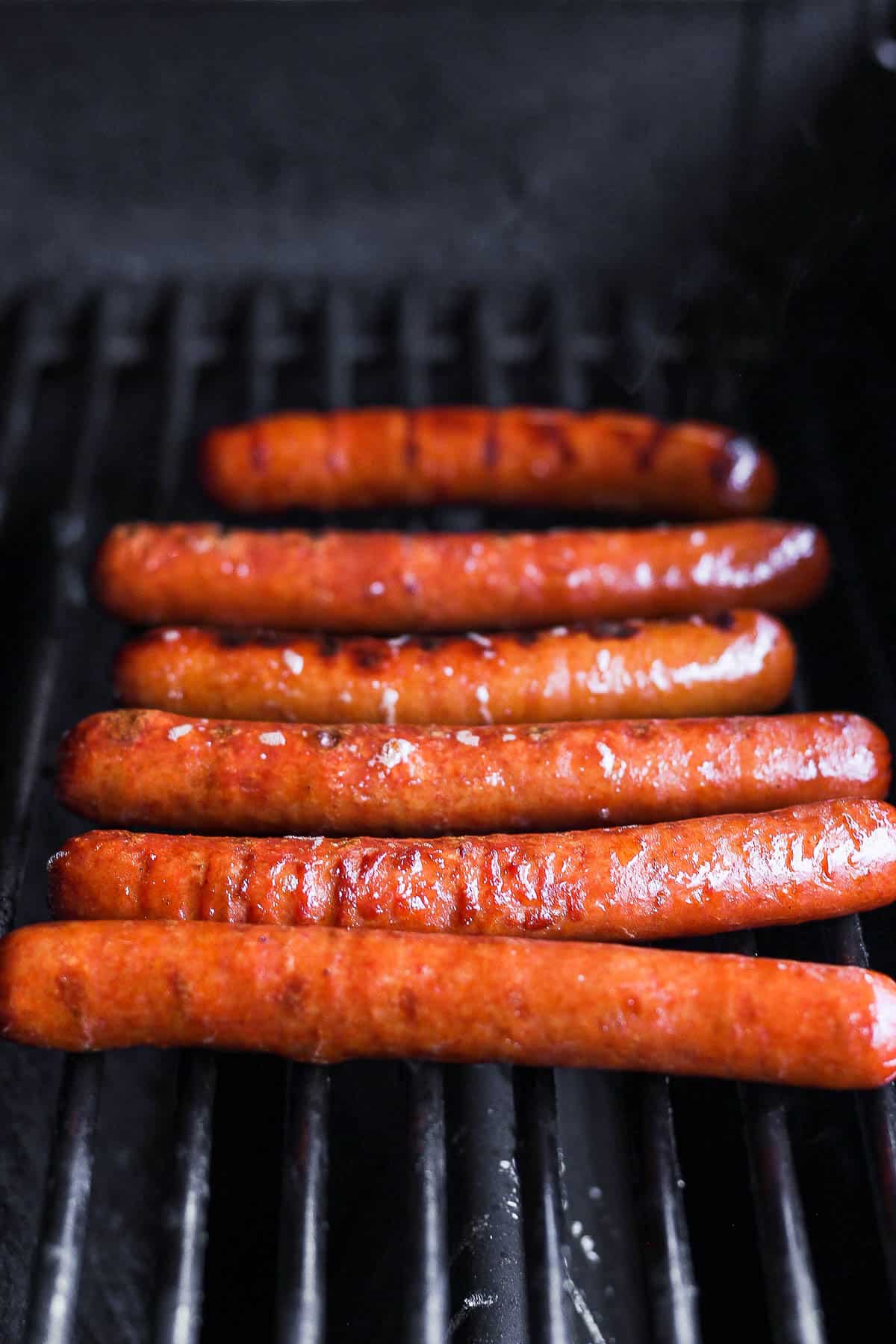 Hot dogs on the grill.
