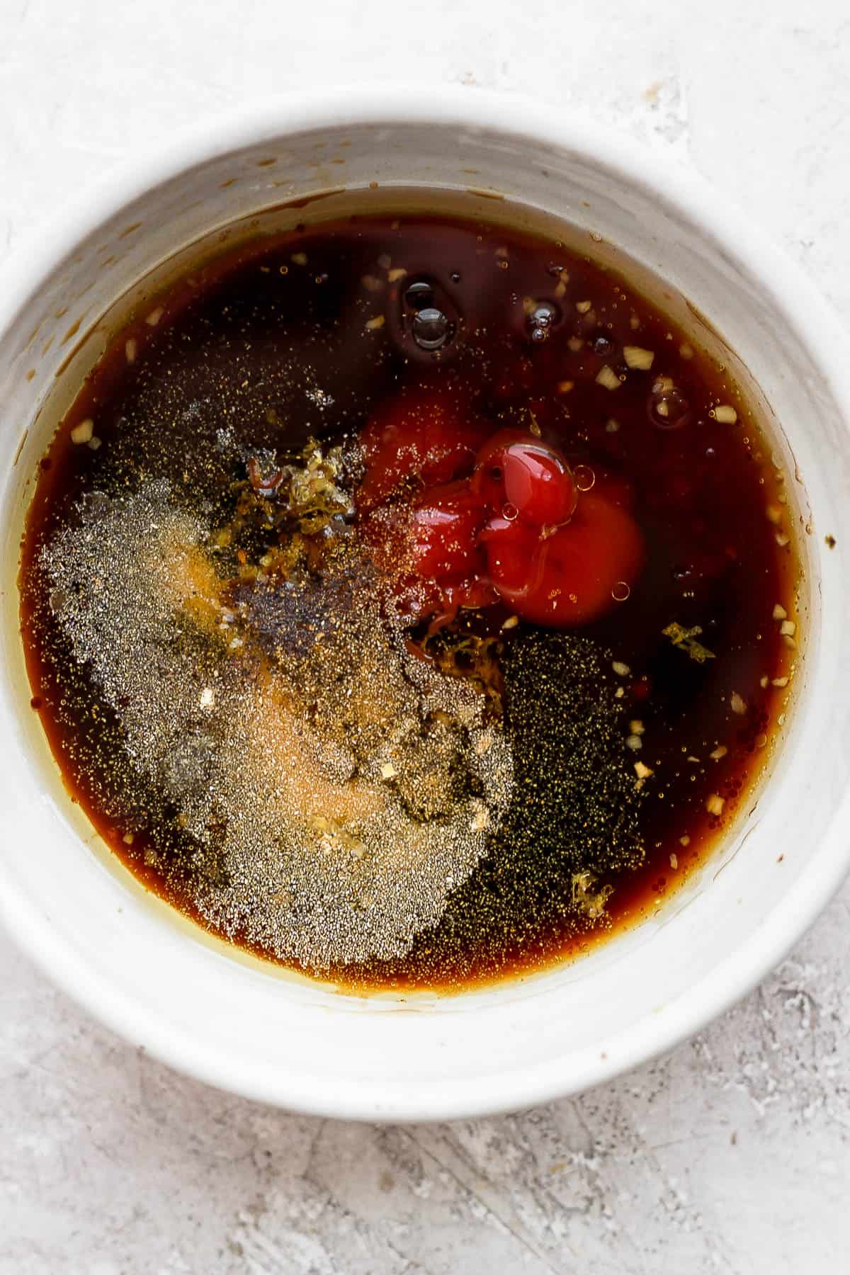 Ingredients for rib marinade in a small bowl.