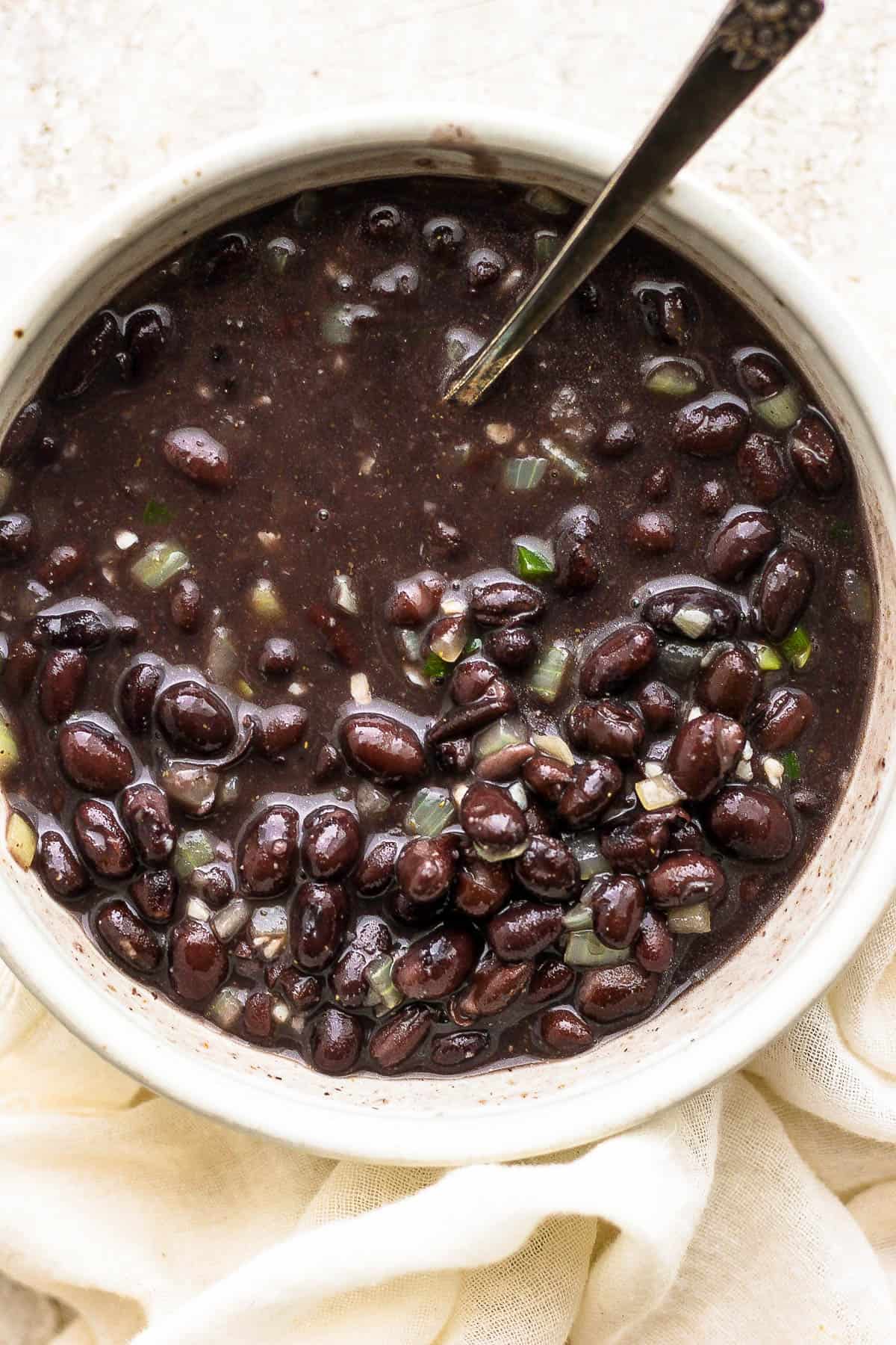 A bowl of seasoned black beans.