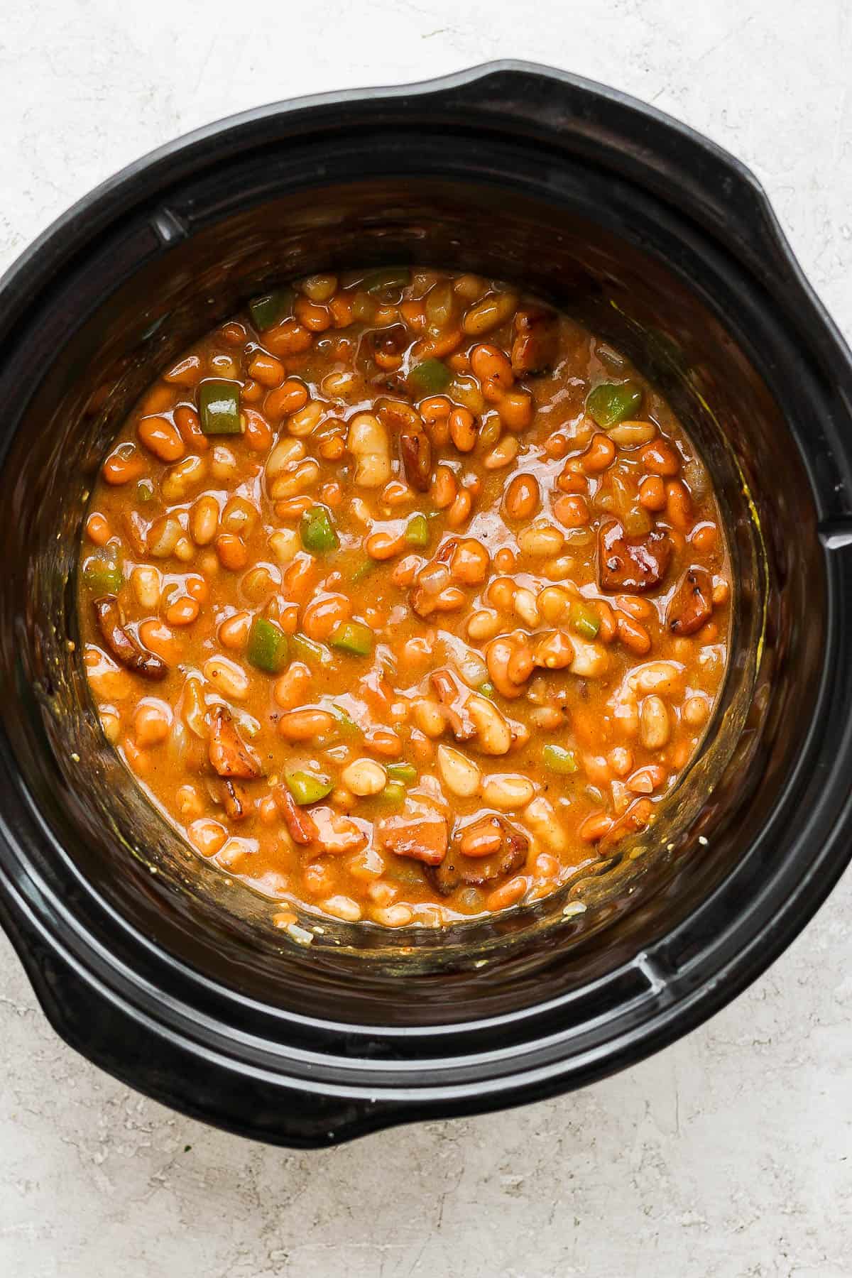The slow cooker baked beans after cooking.