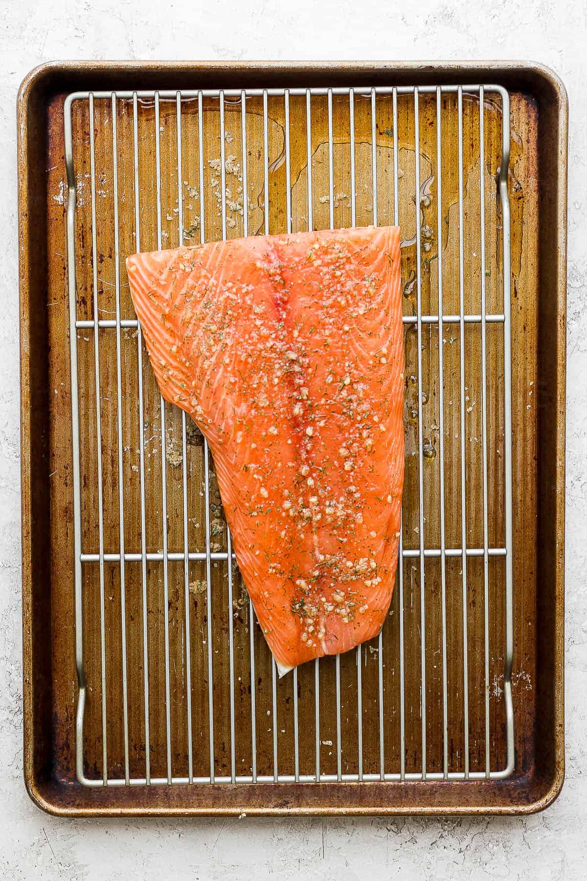 Salmon fillet dry brining on a wire rack.