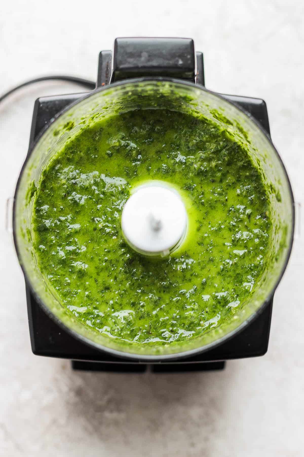 Blended basil vinaigrette in the food processor.