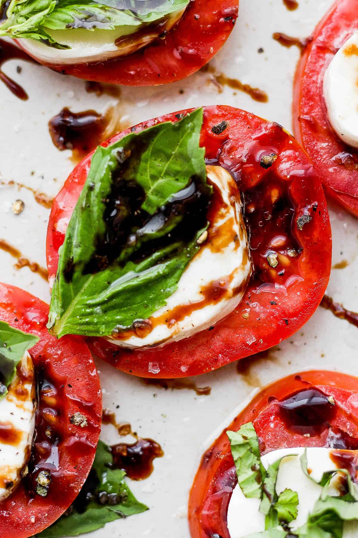 A closeup shot of caprese salad on a plate.