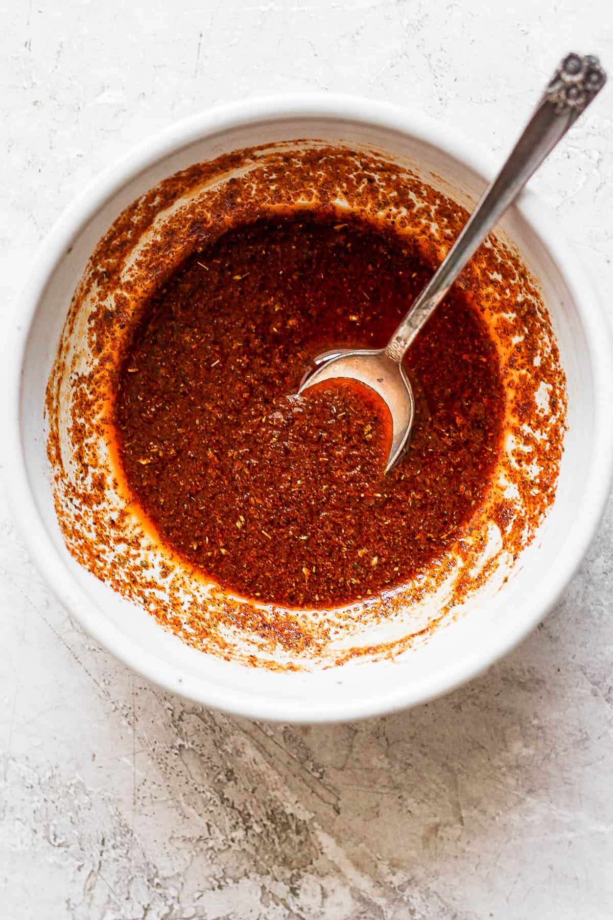 A small bowl with the chicken fajita marinade.