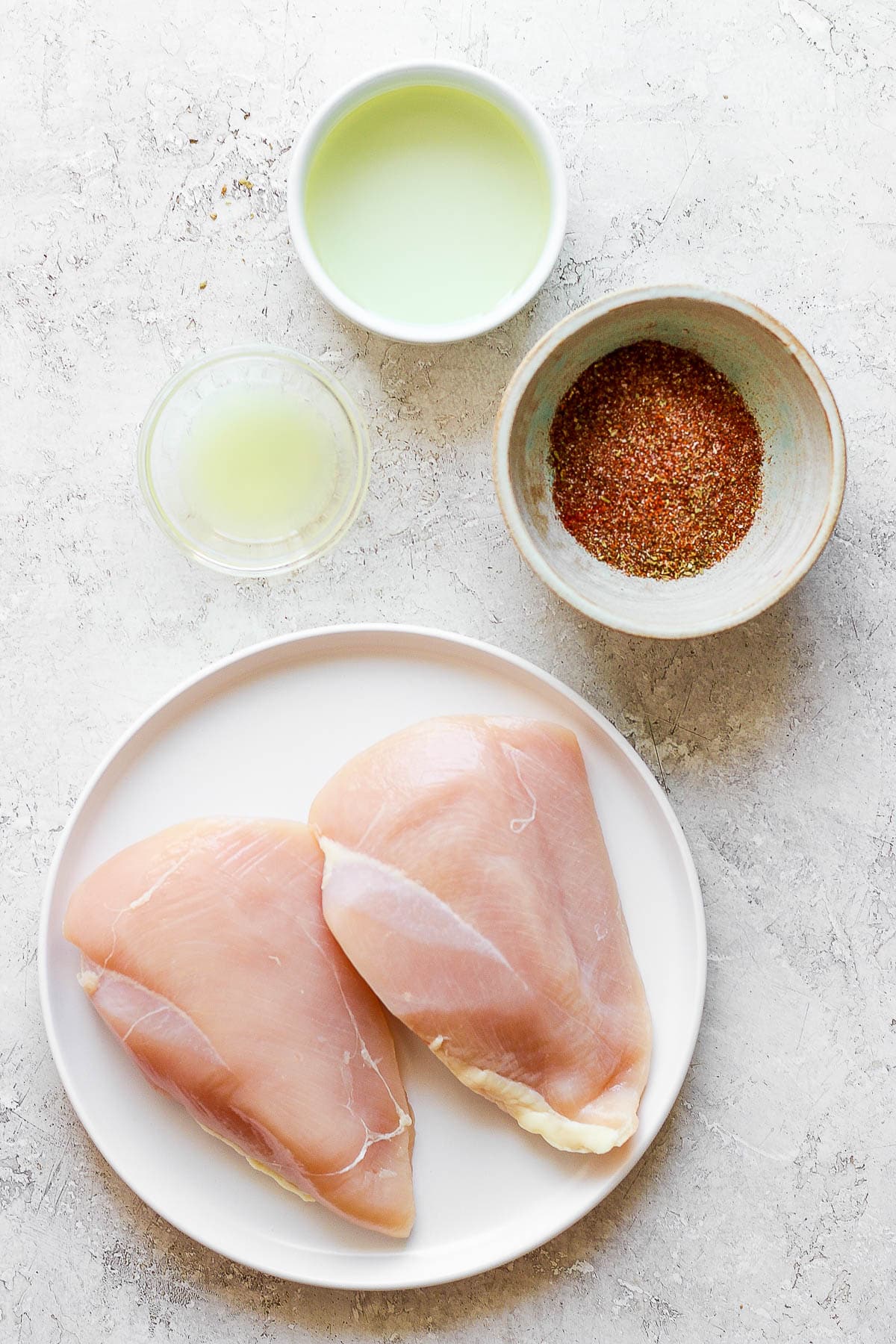 Ingredients for the chicken fajita marinade in separate bowls.