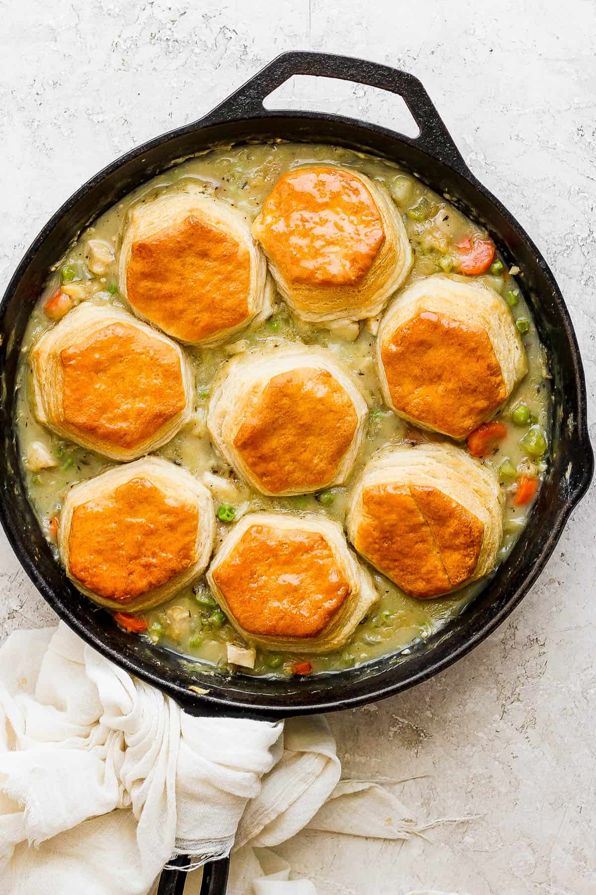 The entire chicken pot pie with biscuits skillet after baking in the oven.