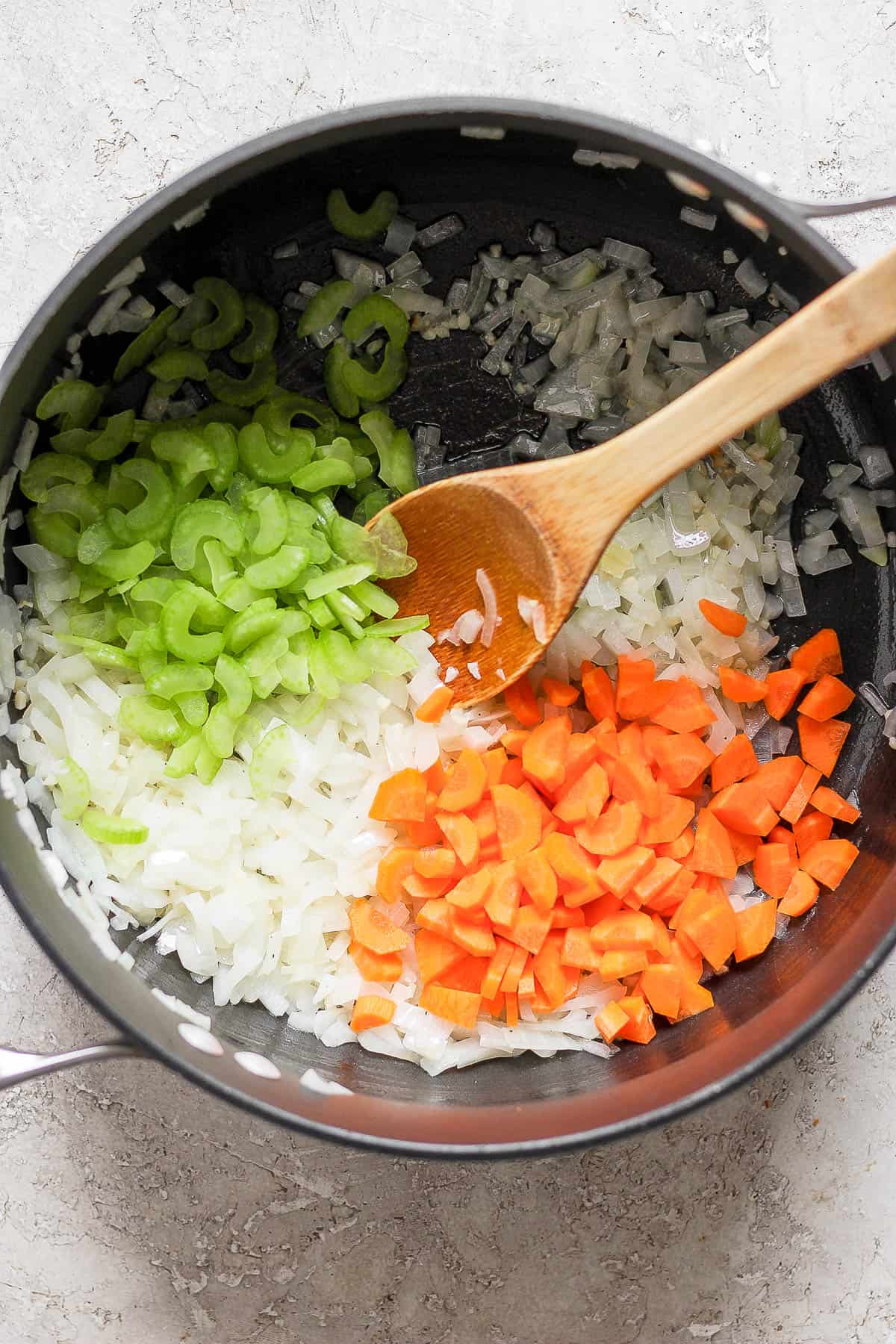 Carrots and celery added to the pot to saute.