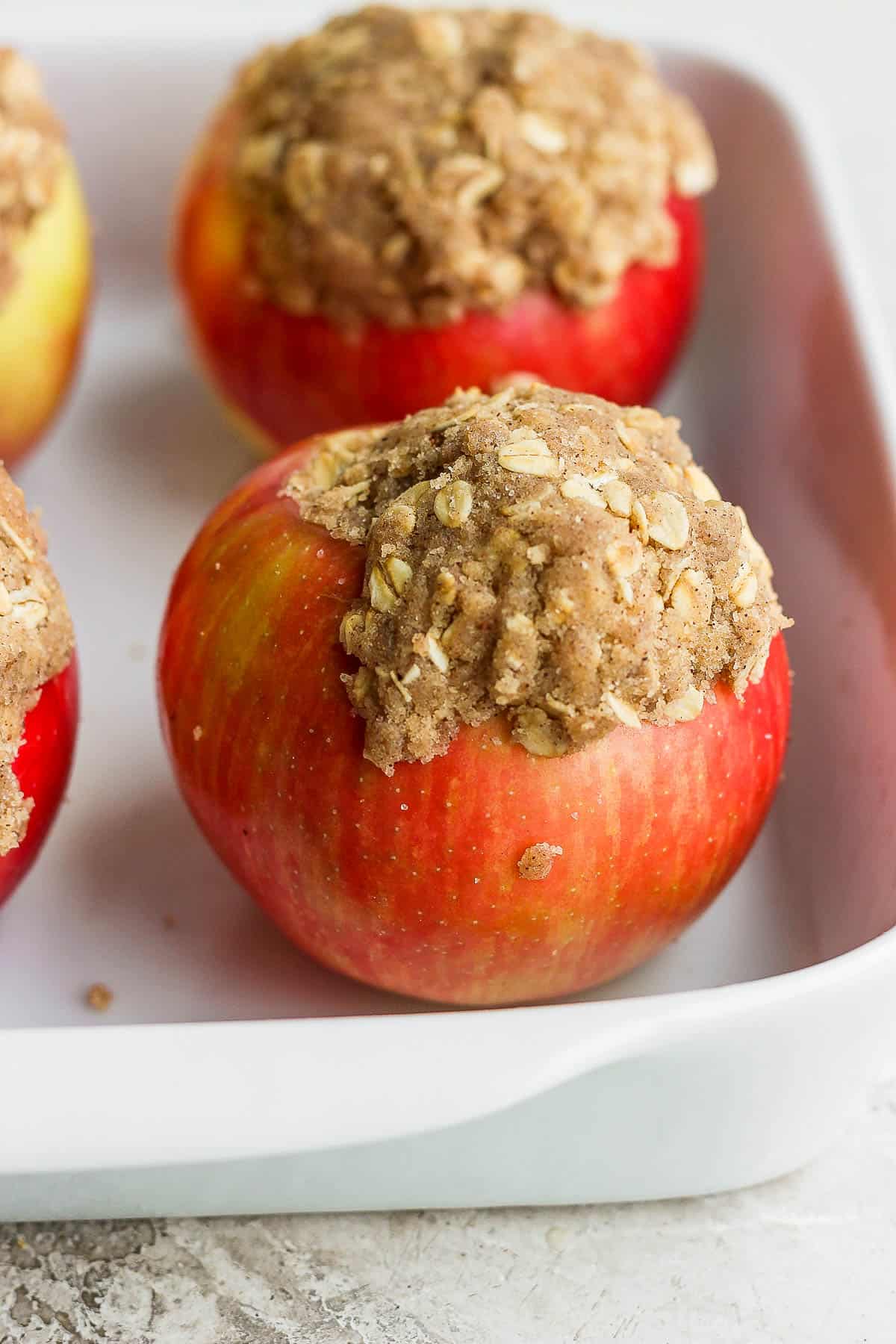 Apples in the baking dish with the filling added.