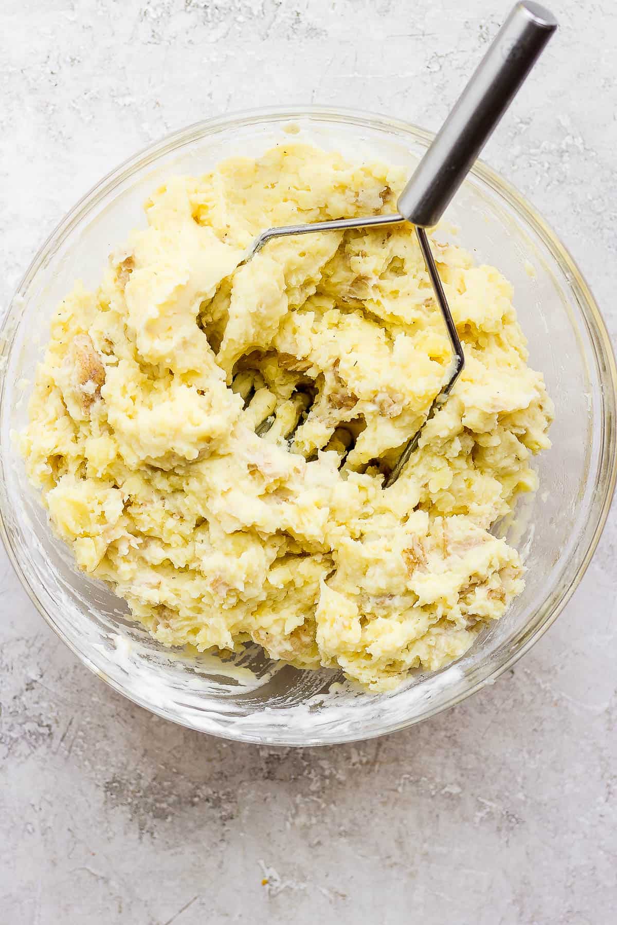 Mashed potatoes with all the other ingredients in a bowl.