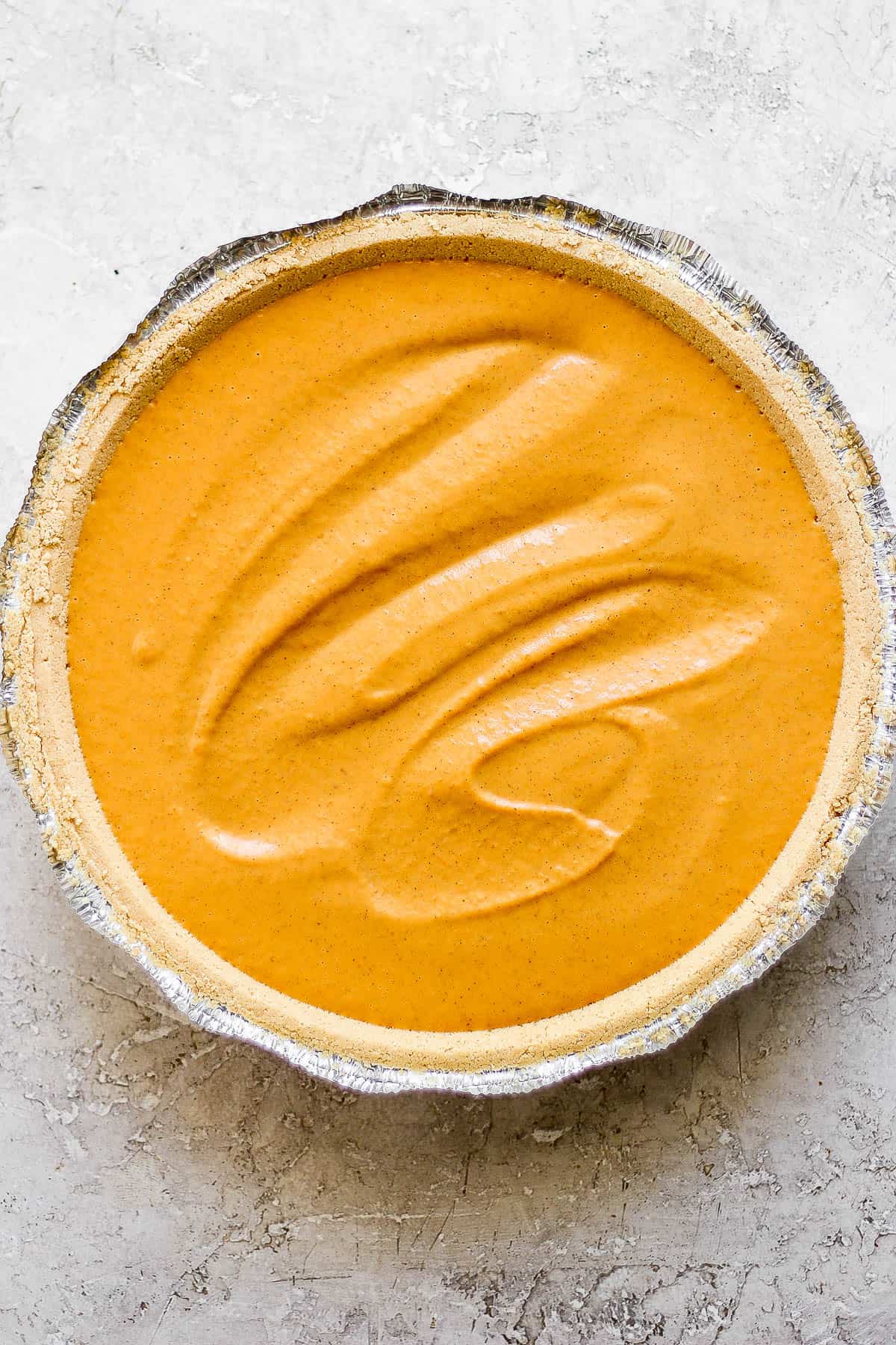 An easy pumpkin pie before baking.