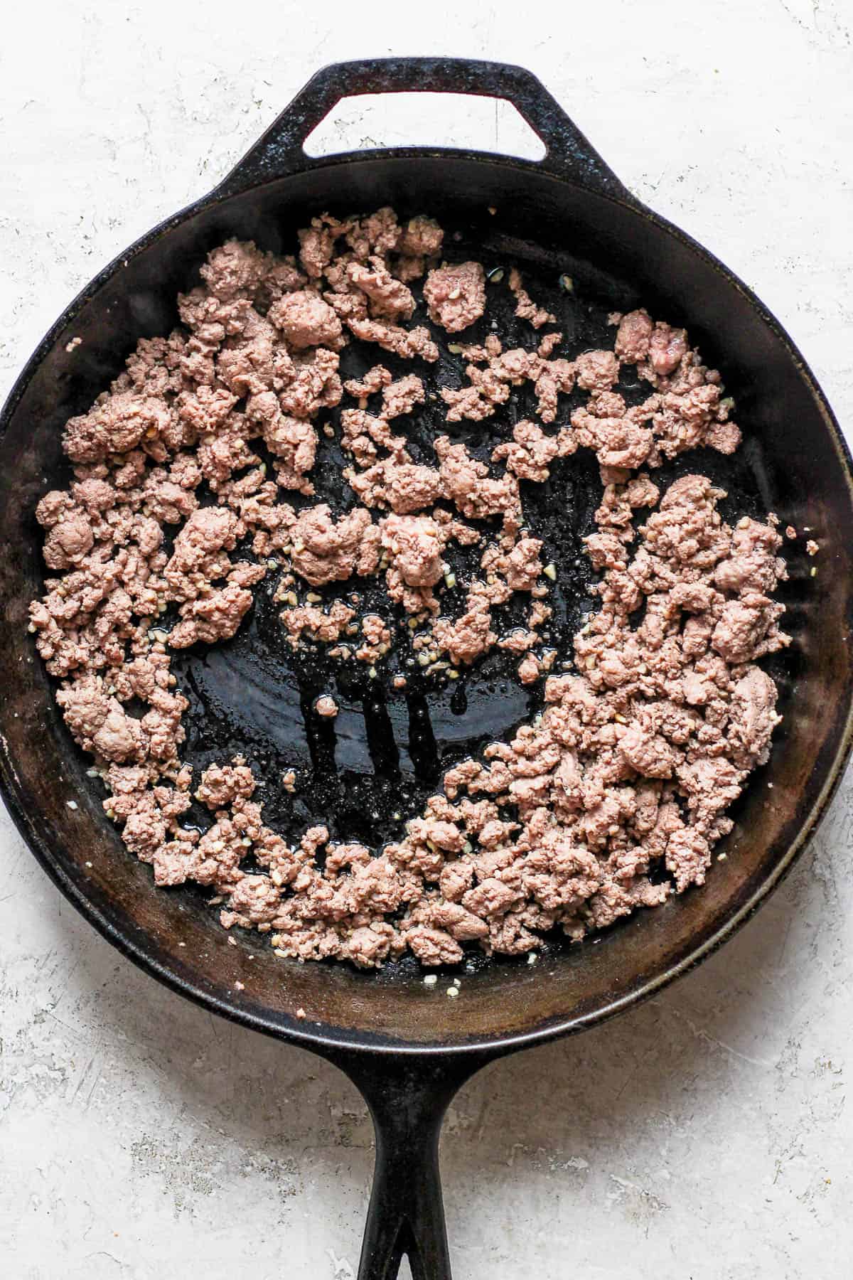 Ground lamb in a skillet.