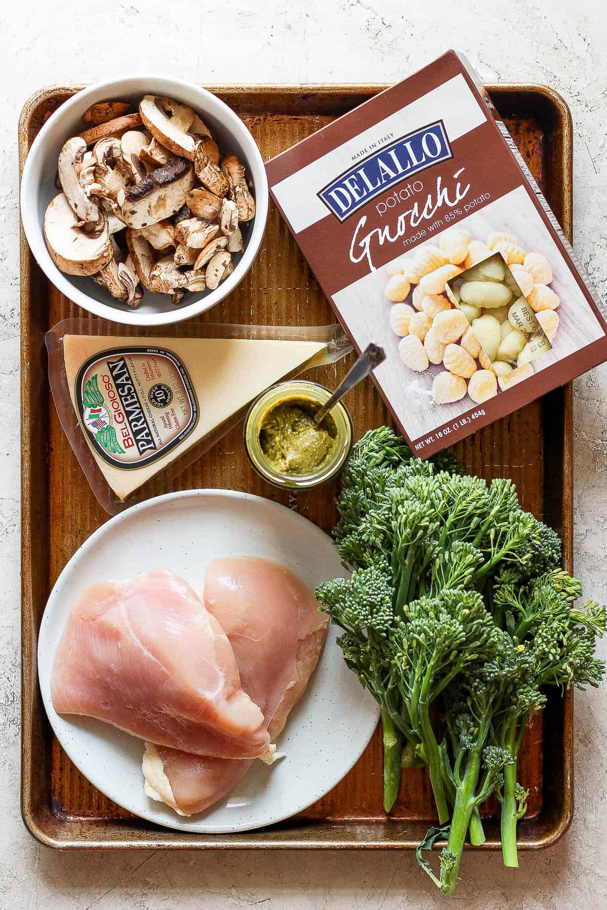 Ingredients for sheet pan gnocchi on a sheet pan.