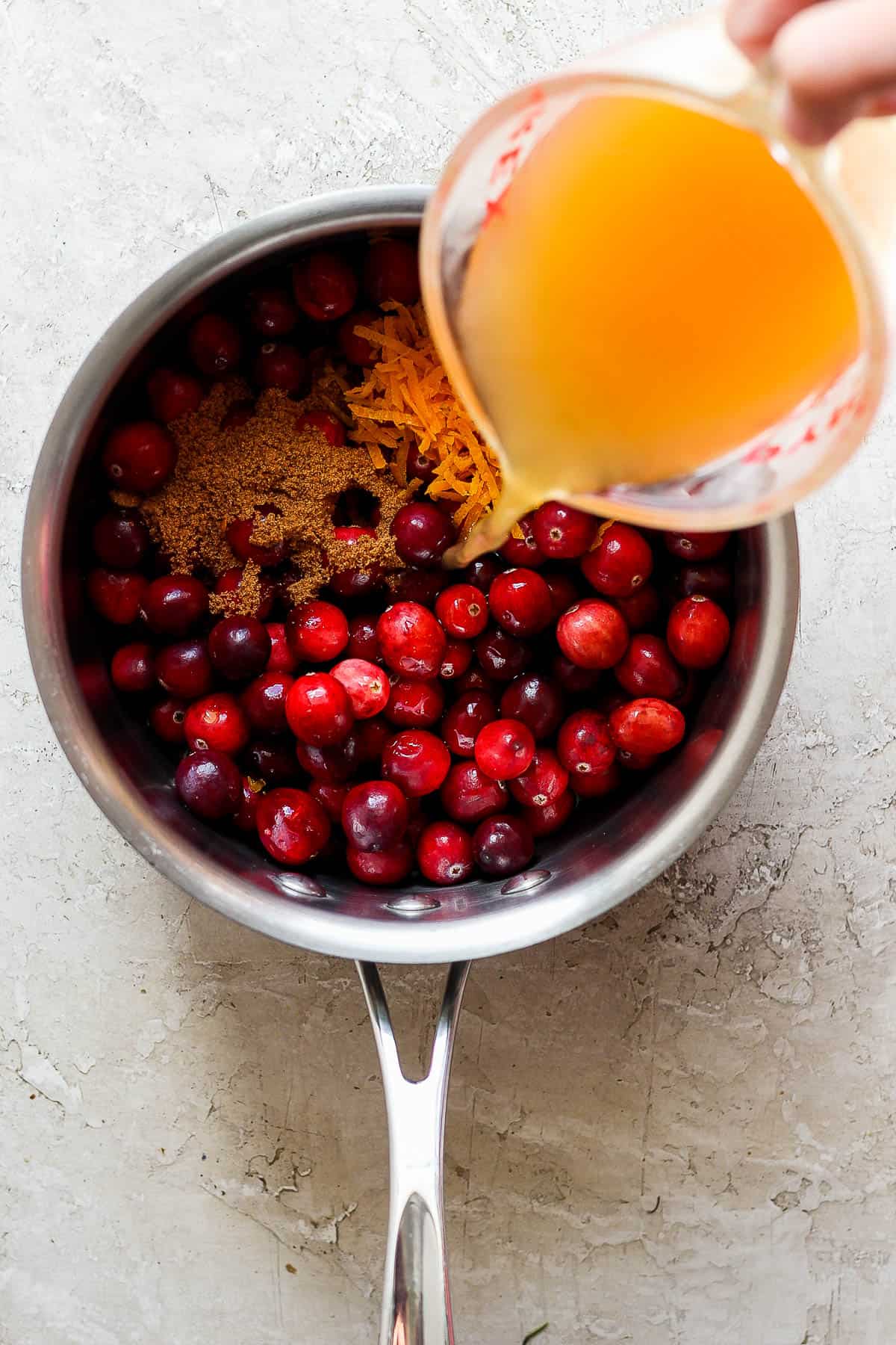 All of the ingredients added to a sauce pan.