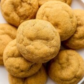 Top down shot of a plate of gluten free ginger molasses cookies.
