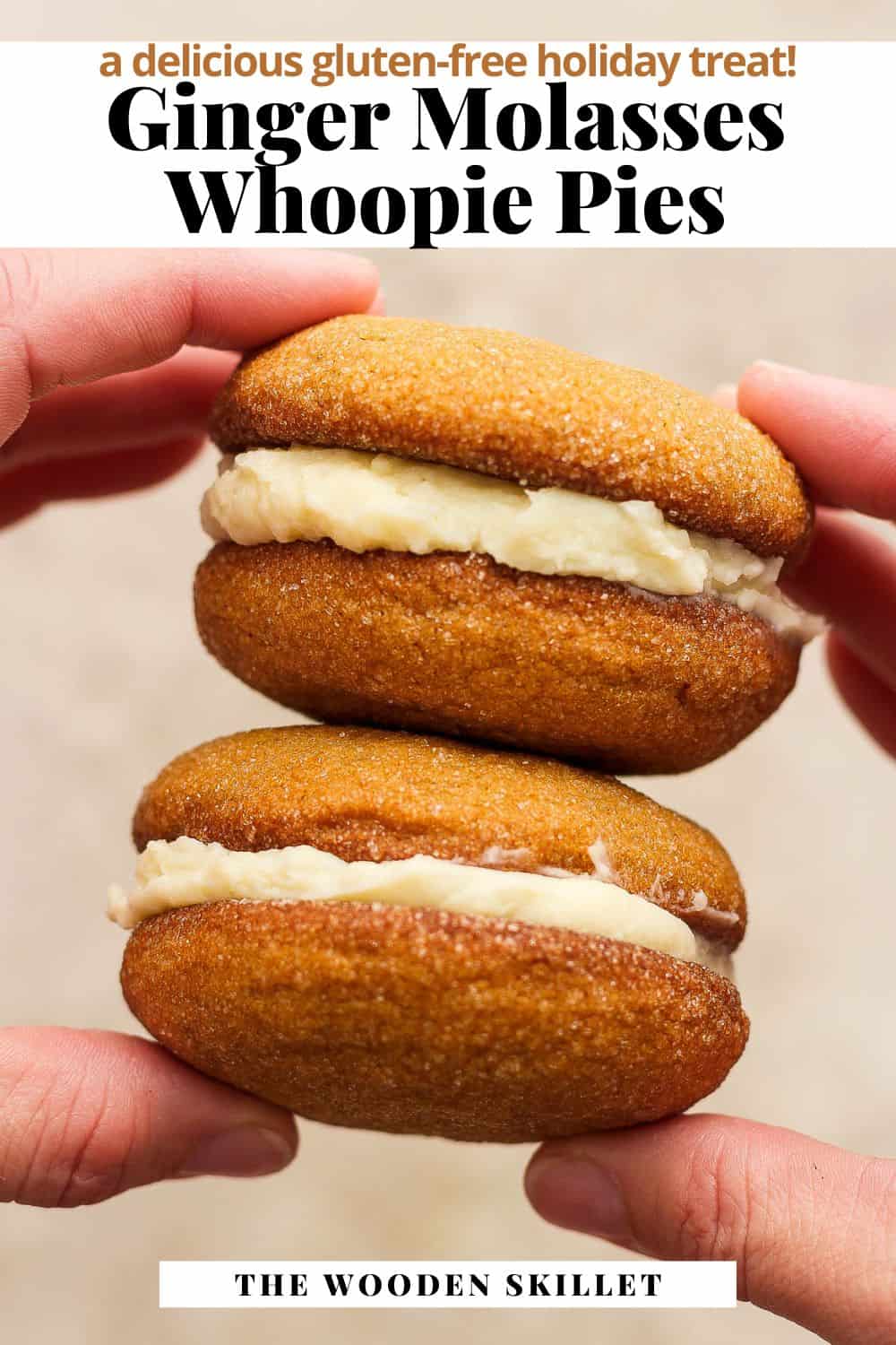 Pinterest image showing two hands holding a stack of two ginger molasses whoopie pies. The title reads Ginger molasses whoppie pies. A delicious gluten-free holiday treat!