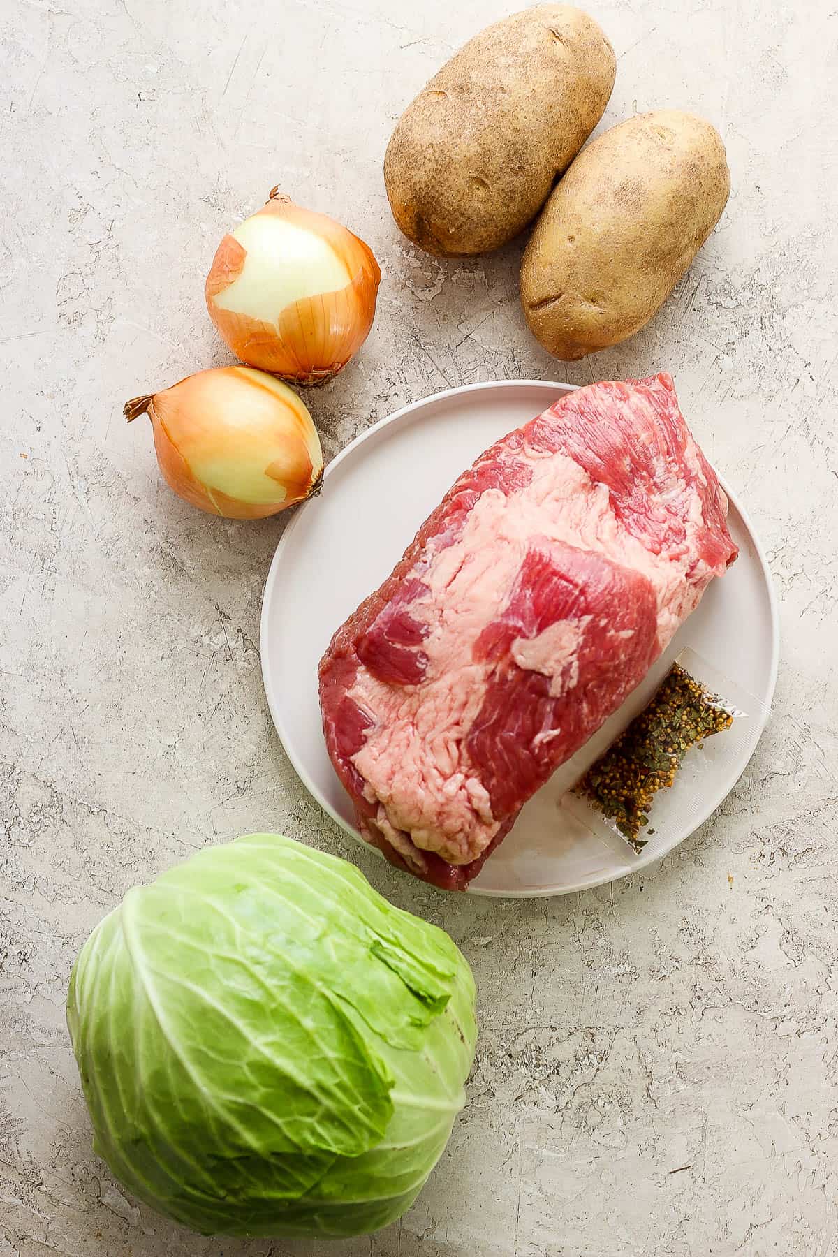 The ingredients for Instant Pot corned beef and cabbage on the counter.