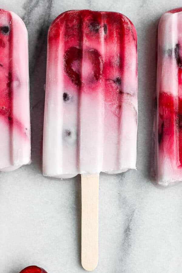 The best recipe for some strawberry, cherry, and cream popsicles.