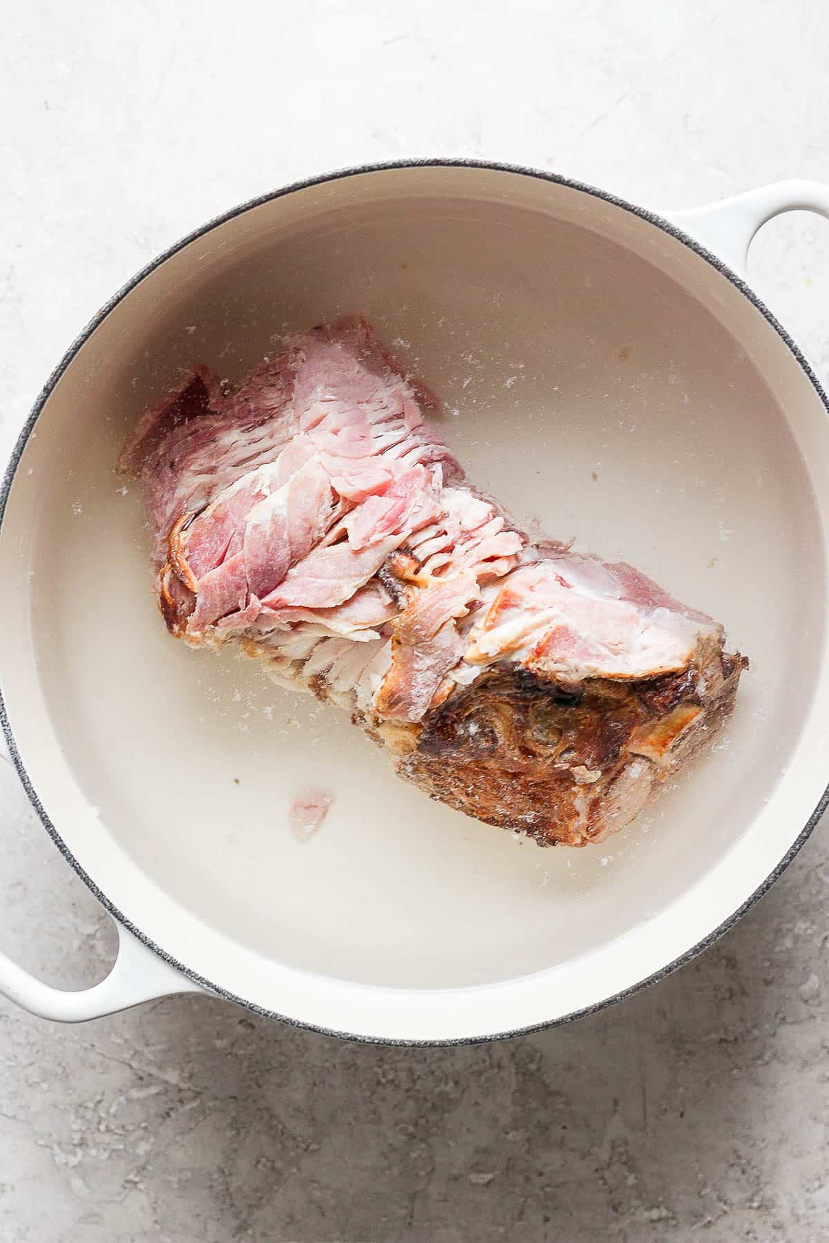 Ham bone in a large soup pot.
