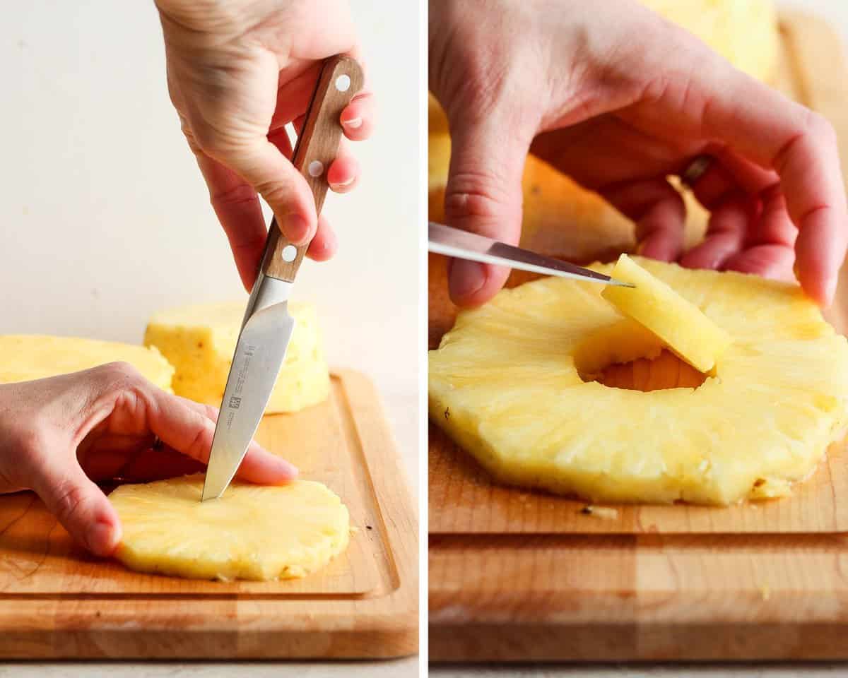 A knife cutting a circle out of the middle of the pineapple round to remove the core.
