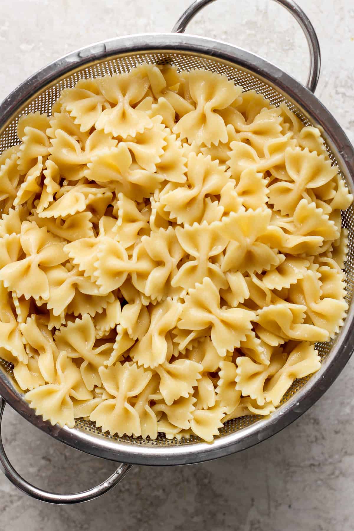cooked pasta in a colander.