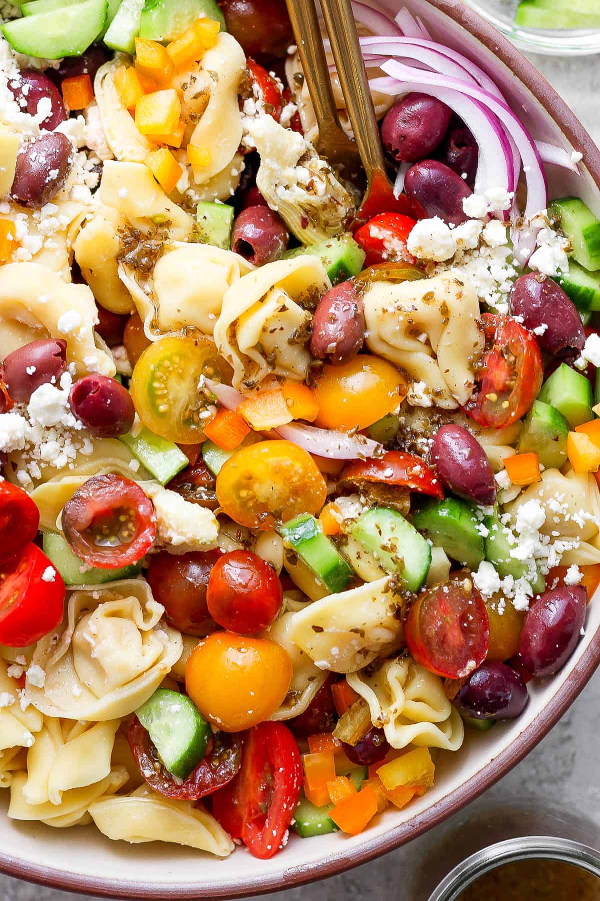 A mixed up bowl of tortellini salad.