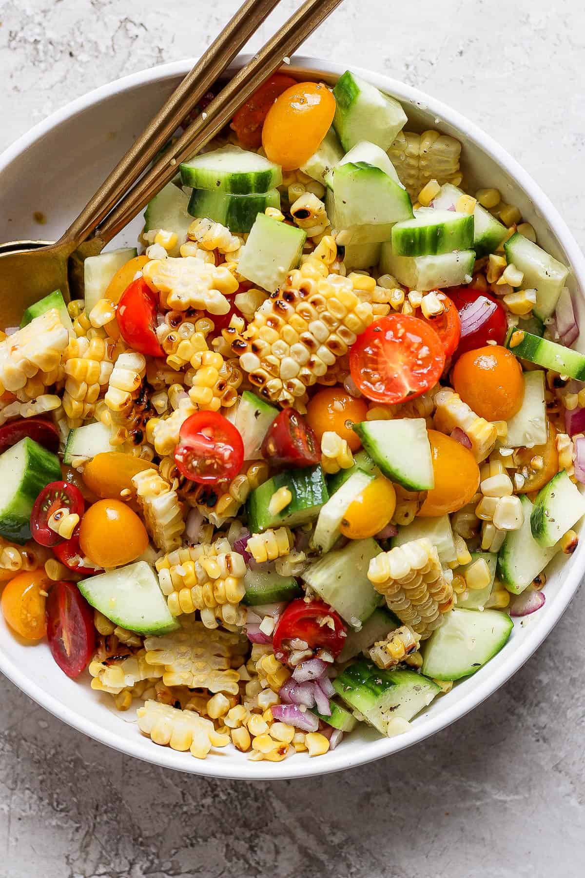 A large bowl of grilled corn salad.