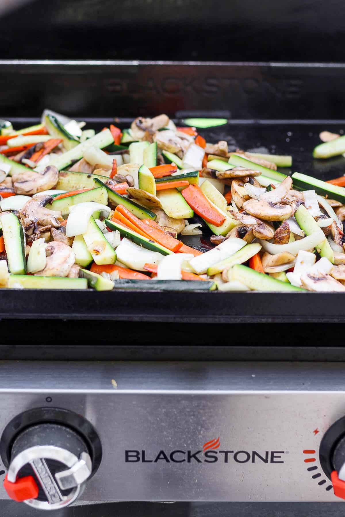 Hibachi vegetables on a blackstone griddle.