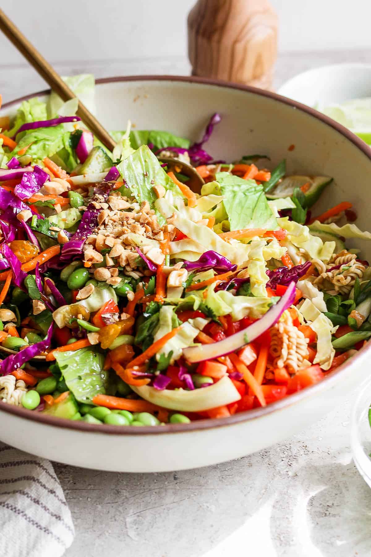 The entire ramen salad being tossed together.