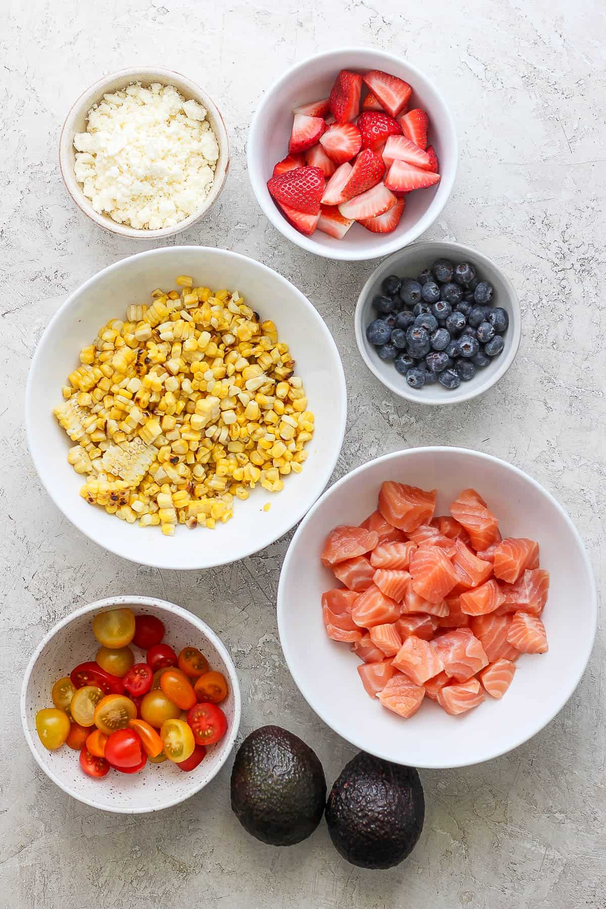 Rice bowl ingredients in separate bowls.